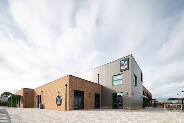 Brick elevations and entrance at Myton School in Warwick